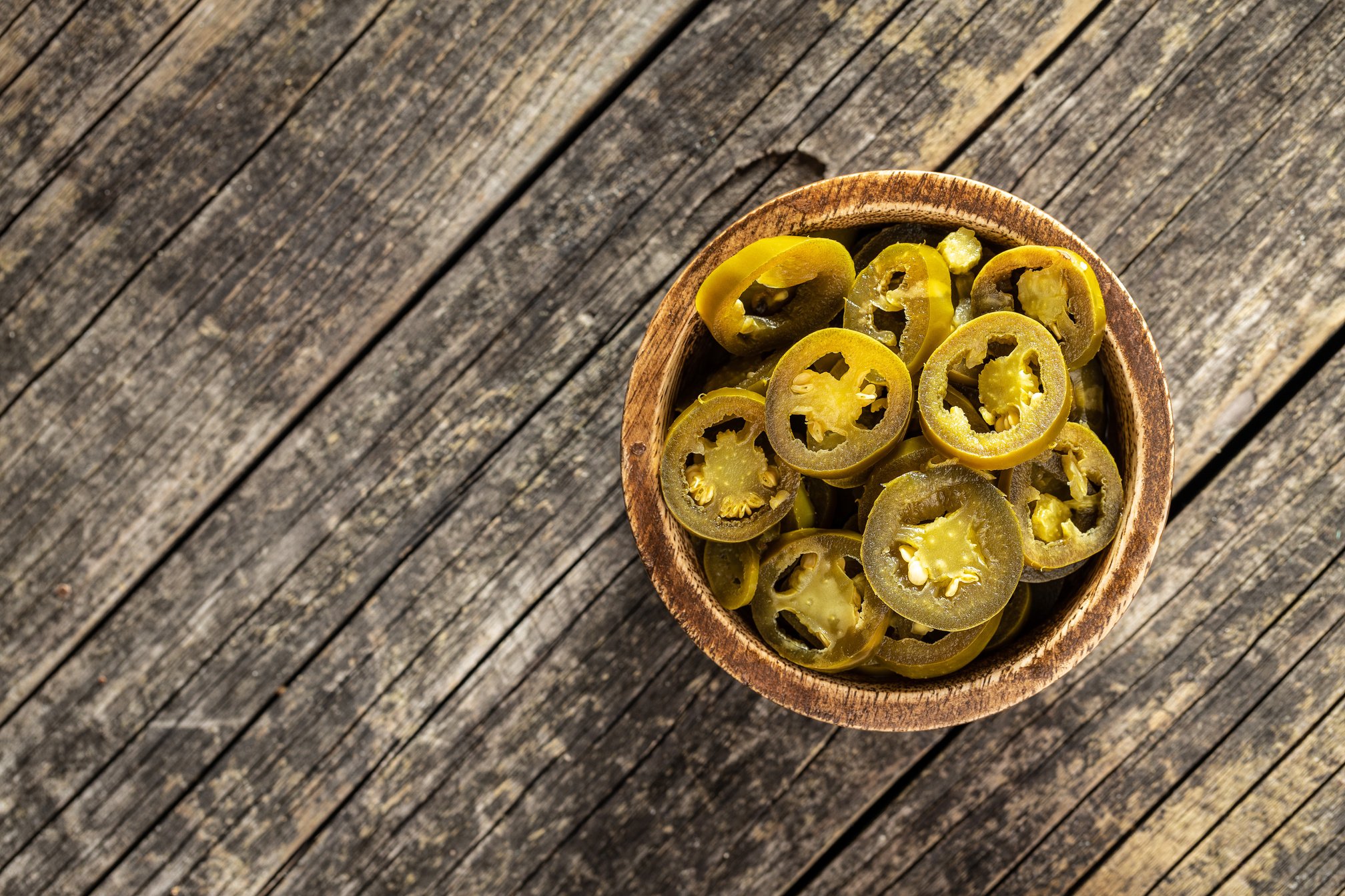 Pickled sliced jalapeno. Green jalapeno peppers